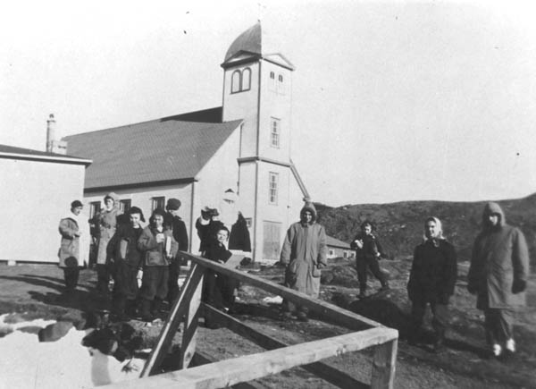 354: Santa Claus and a crowd in front of the church on Red Island.